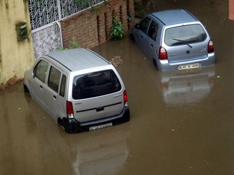 The area appeared virtually inaccessible as all roads had completely submerged under the water. In this picture, one can see the cars submerged under waist length water.