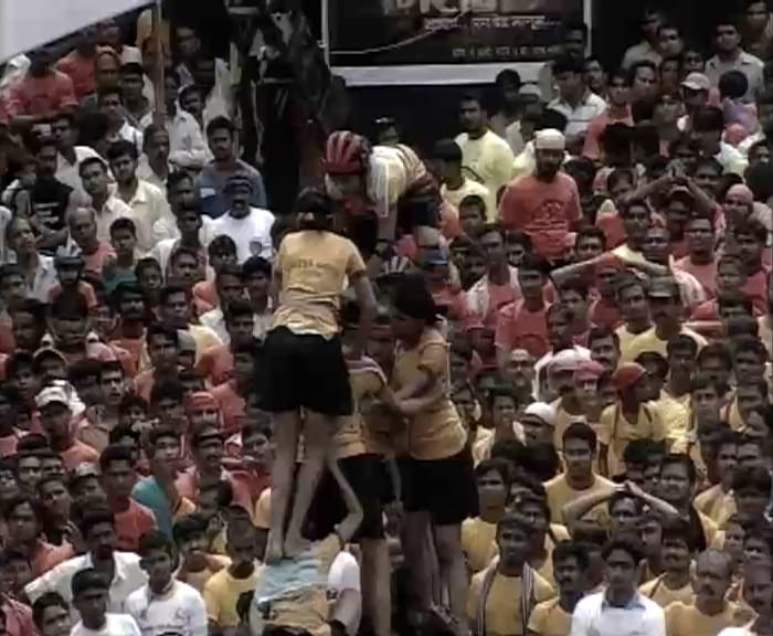 During the ?dahi handi' ritual, a large earthenware pot is filled with milk, curds, butter, honey and fruits and is suspended from a height of 20 to 40 feet.<br><br>Hundreds of young boys come forward every year to claim the winning prize by constructing a human pyramid to break the pot.