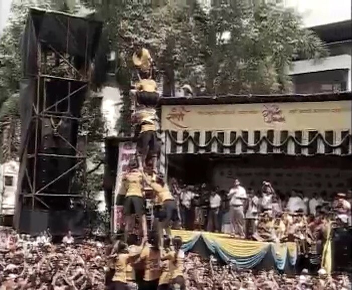 Seen here, teams of young men form human pyramids to reach Dahi-Handi during the Janmashtami rituals in Mumbai.