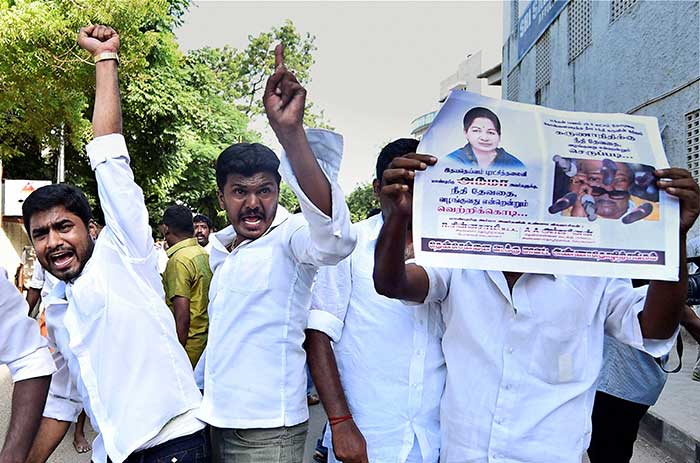 Tamil Nadu Chief Minister J Jayalalithaa was on Saturday sentenced to four years in prison after being found guilty in a disproportionate assets case. She has been sent to the Bangalore Central Jail.</br></br><b>In this photo:</b>AIADMK supporters protest after Ms Jayalalithaa was convicted by a Bangalore court. (Press Trust of India Photo)