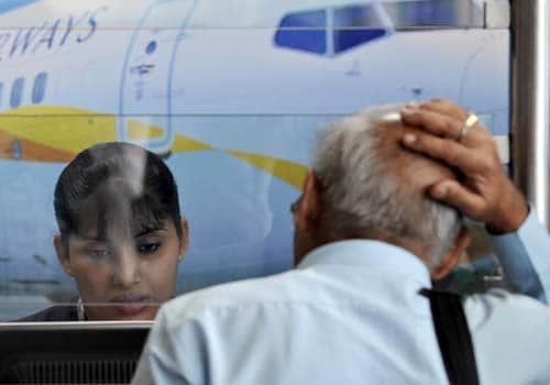 <span class="lh16 fa fs12 fb">An air traveller reacts while waiting at the Jet Airways counter at the city airport in Mumbai on September 8, 2009. (AFP Photo)</span>