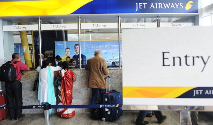 <p><strong>Relief at last:</strong> Air travellers crowd the Jet Airways counter at the city airport in Mumbai.<br />
<br />
The Jet management has decided to give 50 per cent discount on its flights to bring back customers after strike. This discount is likely to be given on domestic flights.<br />
<br />
Jet's daily revenue of eight million dollars had dropped dramatically and the number of passengers came down from Rs 23,000 per day to Rs 7,500 during the five-day-long pilots' strike. <em>(AFP)</em></p>