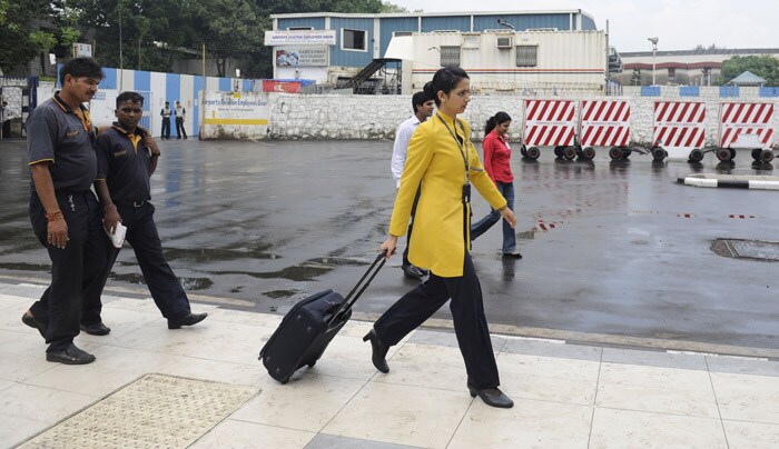 <p><strong>Let's fly:</strong> A Jet Airways flight attendant arrives for duty at the city airport in Mumbai.<br />
<br />
Services on India's second-largest private airline resumed after the pilots ended their stir, the company said.<br />
<br />
The airline said an 'amicable agreement' has been reached with the pilots who took mass sick leave on September 8 after the sacking of two senior pilots for setting up an unrecognised trade union. <em>(AFP)</em></p>
