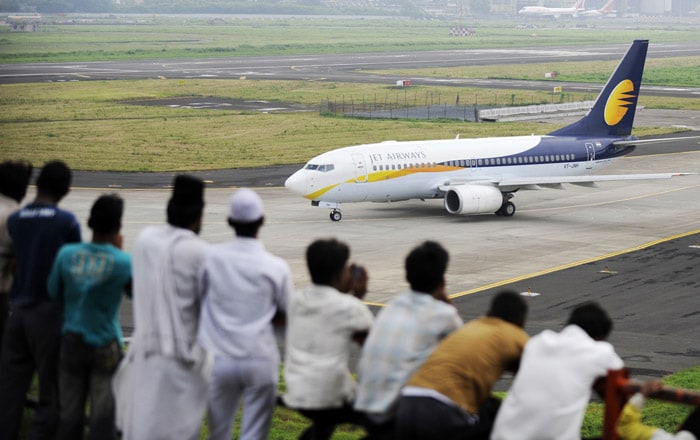 <p><strong>Set for take-off:</strong> A Jet Airways aircraft prepares for take off at the city airport in Mumbai on Sunday. In the course of the settlement, the Jet management decided to take back the four pilots who were sacked.<br />
<br />
But in the five days of strike, the company has lost an estimated Rs 200 crore.<br />
<br />
Nearly 500 pilots, who reported 'sick' for the last five days, decided to resume their duties after a nine-hour-long meeting with the airlines management in Mumbai on Saturday night. <em>(AFP)</em></p>