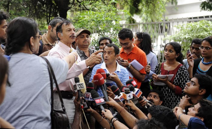 <p><strong>Clinching the deal:</strong> President of the Indian National Aviators Guild (NAG) Captain Girish Kaushik gestures as he speaks with the media in Mumbai.<br />
<br />
In the deal announced at 2 am on Sunday morning, the pilots had to agree to a major compromise - giving up the National Aviators Guild. <em>(AFP)</em></p>