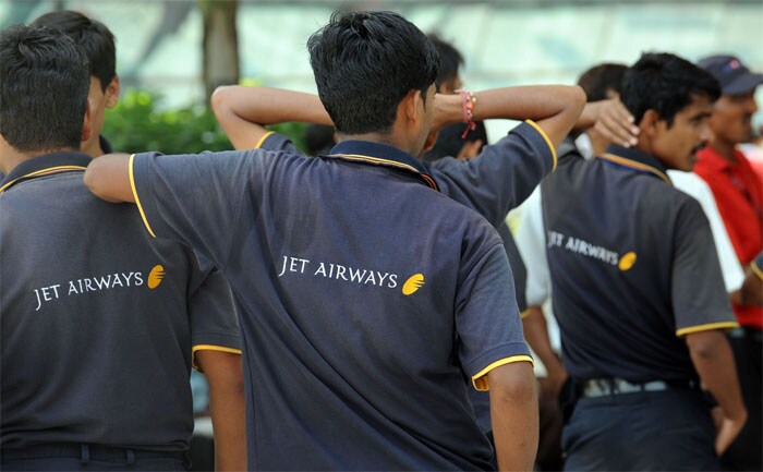 <p><strong>Back to business:</strong> Jet Airways ground staff chat amongst themselves at the city airport in Mumbai.<br />
<br />
Sources say there were murmurs of a division within the pilot community, especially younger recruits who were worried about a management crackdown.<br />
<br />
Also in a shrinking aviation industry in a recession year, job concerns took priority over the formation over a union. <em>(AFP)</em></p>