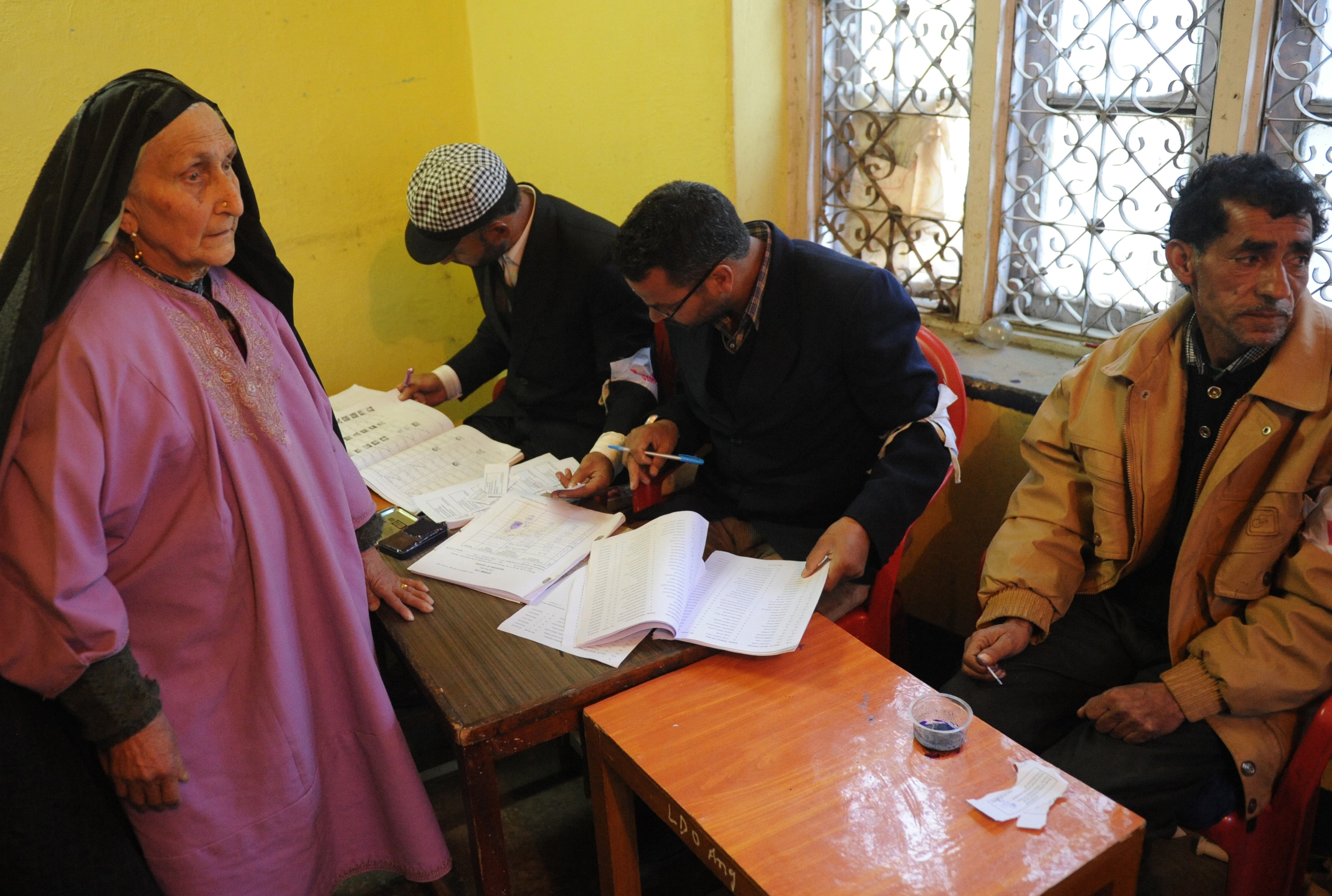 An elderly Kashmiri lady waits to cast her vote at a polling station in Khanabal area of Anantnag District. In a terrorist attack in Shopian in South Kashmir, an election official was killed and five others injured