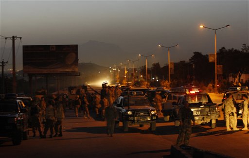 The attackers were heavily armed with machine guns, anti-aircraft weapons, rocket-propelled grenades, hand grenades and grenade launchers, the Afghan officials said. Afghan police rushed to the scene and firefights broke out. They battled for hours with gunmen who took up positions on the roof. (AP Photo)