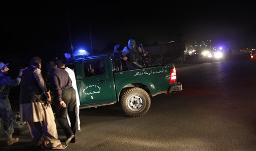 After the gunmen were killed, the hotel lights that had been blacked out during the attack came back on. Afghan security vehicles and ambulances were removing the dead and wounded from the area. (AP Photo)