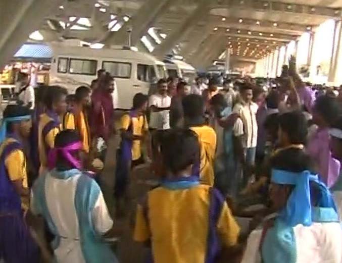 DMK supporters showered her with flower petals when she arrived at Chennai airpot.