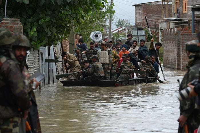 The Army, along with the Air Force, has launched a vigorous operation in rescuing people from inundated areas. Nearly 11,000 people have been rescued so far. (Agence France Presse photo)