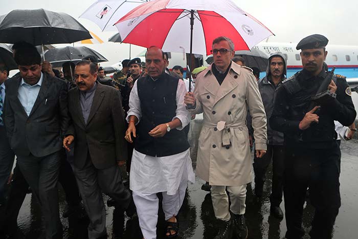 Union Home Minister Rajnath Singh and state chief minister Omar Abdullah (both seen in this photo)visited the flood-affected areas in the state on Saturday. (Associated Press photo)