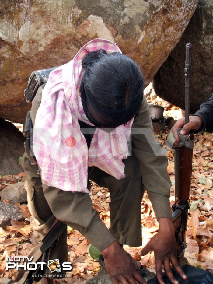 A lady commando hides her face to avoid identification. She is one of the personal bodyguards of the Maoist chief comrade Sunil. A lady commando hides her face to avoid identification. She is one of the personal bodyguards of the Maoist chief comrade Sunil.