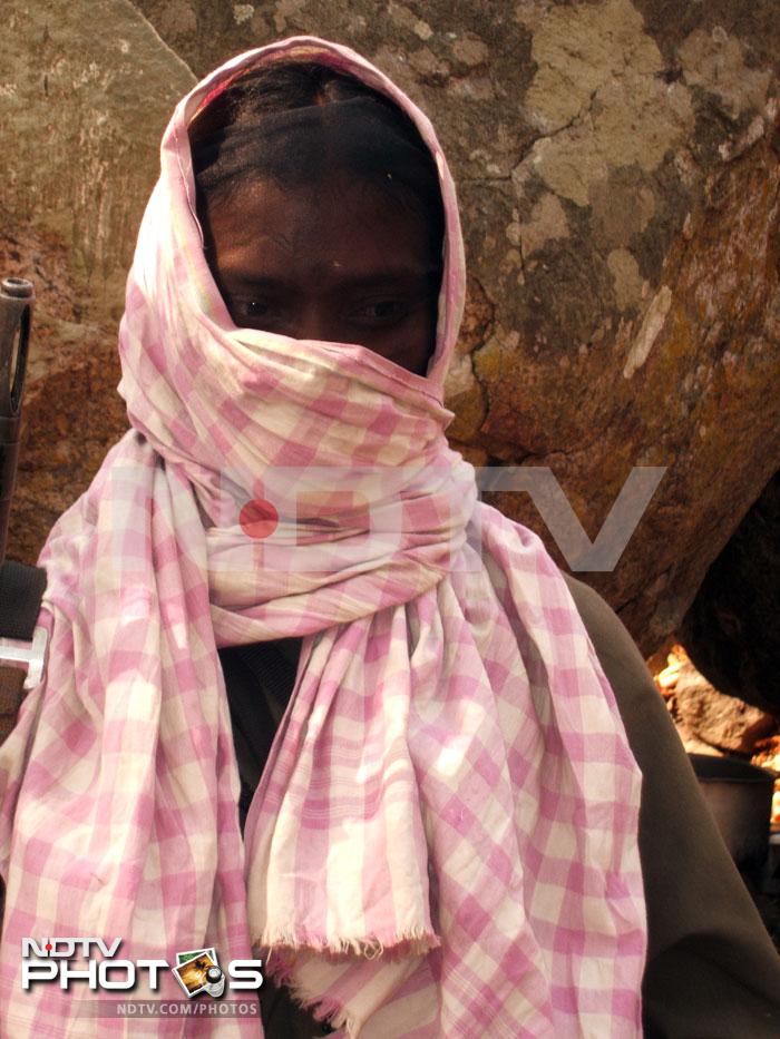 A Maoist cadre who led the media team in the final leg of the journey, quickly covers his face because no one there is supposed to reveal their identity. A Maoist cadre who led the media team in the final leg of the journey, quickly covers his face because no one there is supposed to reveal their identity.
