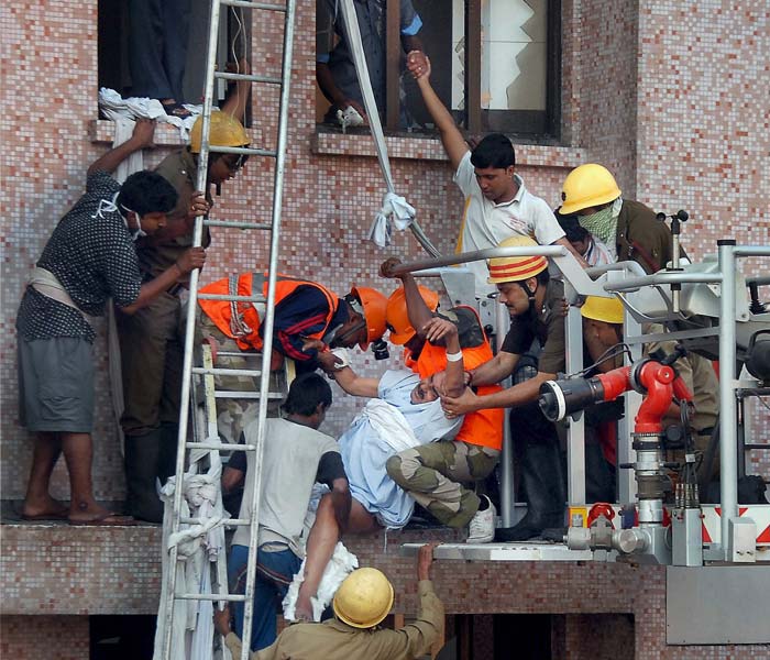 Meanwhile, anxious relatives wait for news of their loved ones, some of whom are still trapped inside the hospital.