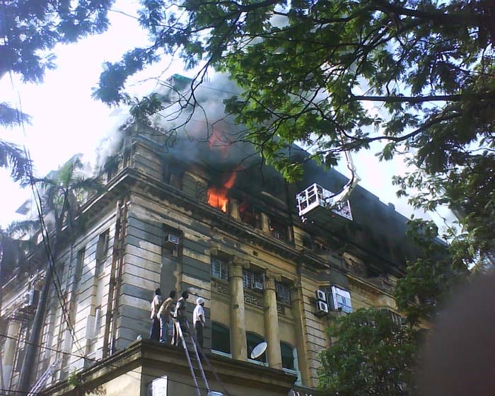 Ladders were used to reach the people trapped inside the building. Image Courtesy: Ankit Bothra