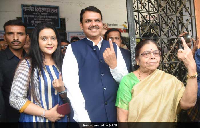 Maharashtra Chief Minister Devendra Fadnavis and his wife Amruta Fadnavis cast their vote in Nagpur