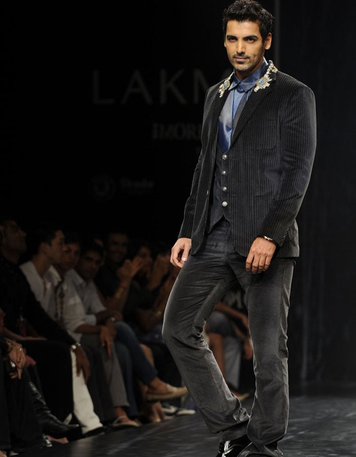 Bollywood actor John Abraham looked dashing in a creation by Indian designer Rocky S on the third day of Lakme Fashion Week(LFW) Spring/Summer 2010 in Mumbai. (Pics: AFP)