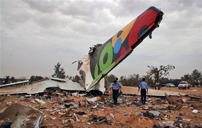 A Libyan plane arriving from South Africa exploded on landing at Tripoli airport on Wednesday. According to the officials, more than 100 people have died in the incident.<br><br>Afriqiyah Airways listed 93 passengers and 11 crew members on board its flight 8U771 from Johannesburg.<br><br> An airport official said that a Dutch boy had survived and he was rushed to hospital near Tripoli.<br><br>The crew members were all Libyan nationals, the official added.<br><br>The crash site was sealed off by security officials and ambulances and emergency vehicles rushed between the airport and the capital, about 50 kilometres apart. (AP Photo)