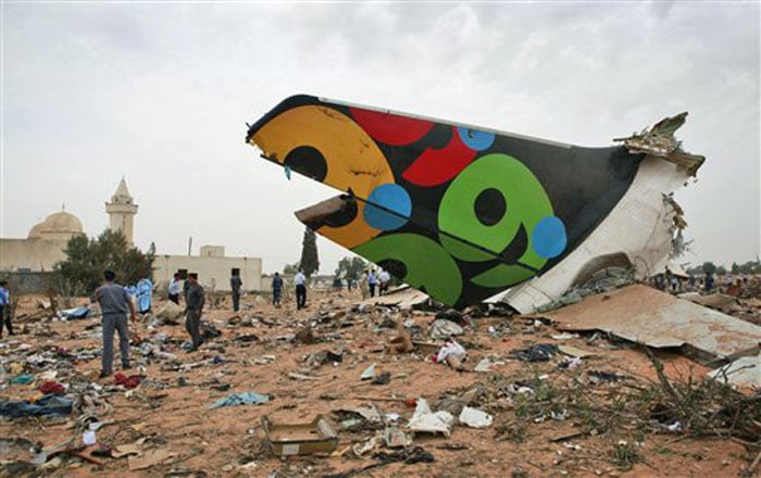 Rescue teams search the site of the Libyan Afriqiyah Airways plane crash in Tripoli. (AP Image)