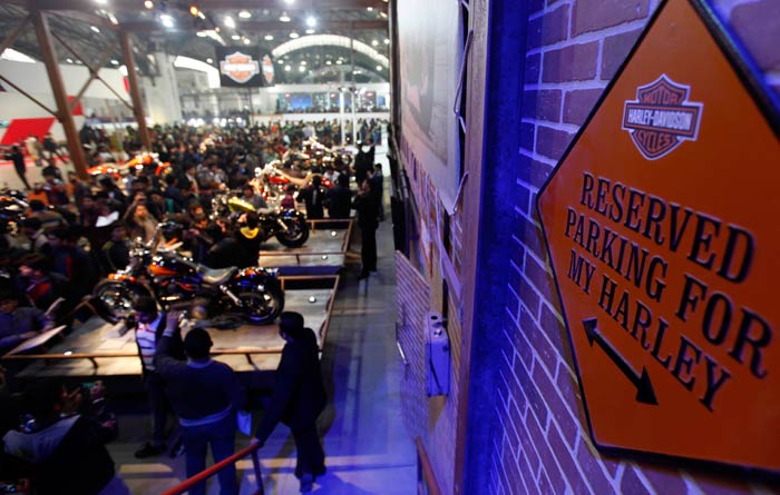 Crowds gather near the stall of Harley Davidson bikes at the Auto Expo 2012.