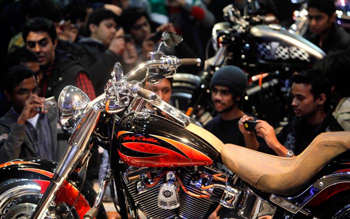 Crowd gather near a Harley Davidson bike at Auto Expo 2012.