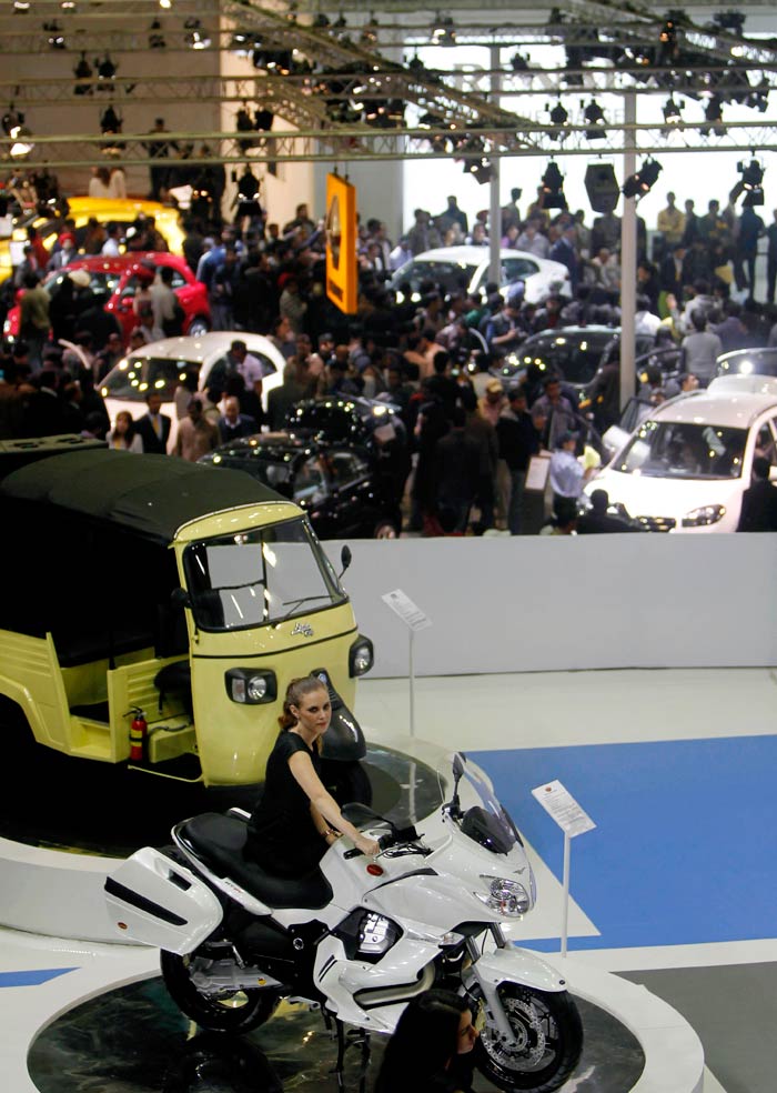 Crowds gather near models unveiled by the auto majors  at the grand fest in Pragati Maidan.
