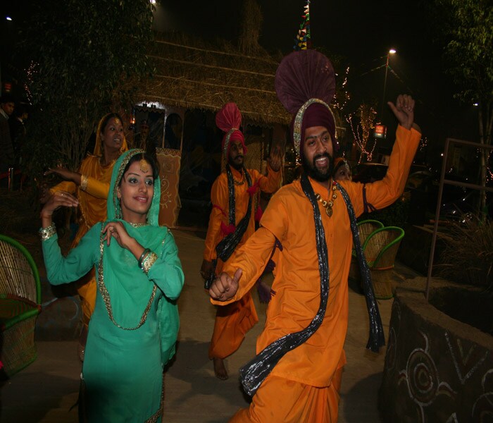 Singing and dancing form an intrinsic part of the celebrations. People wear bright clothes, perform the <i>bhangra</i> and <i>gidda</i> to the beat of the <i>dhol</i>. (NDTV Photo)<br><br><a href="http://www.ndtv.com/news/redirect/url.php?from=homePageWatch&forward_url=http://www.ndtv.com/news/videos/video_player.php?id=1192742" class="text2_link" target="_blank">(Watch: Pongal cheer in Tamil Nadu)</a><br><br><a href="http://www.ndtv.com/news/cities/jaipur_celebrates_makar_sankranti_with_mj_kites.php" class="text2_link" target="_blank">(Read: Jaipur celebrates Sankranti with MJ kites) </a><br><br><a href="http://www.ndtv.com/news/india/kumbh_mela_begins_in_haridwar_today.php" class="text2_link" target="_blank">(Read: Mahakumbh Mela begins in Haridwar today)</a><br><br><a href="http://www.ndtv.com/news/videos/video_player.php?id=1192751" class="text2_link" target="_blank">(Watch: Assam's fish feast)</a><br><br><a href="http://www.ndtv.com/news/redirect/url.php?from=homePageWatch&forward_url=http://www.ndtv.com/news/videos/video_player.php?id=1192748" class="text2_link" target="_blank">(Watch: Life of a Naga Sadhu)</a>