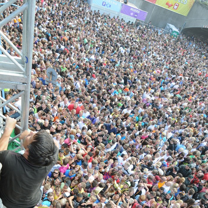 Another picture showing how people climbed up the hill to escape from the tunnel during the Love Parade. (AFP Photo).