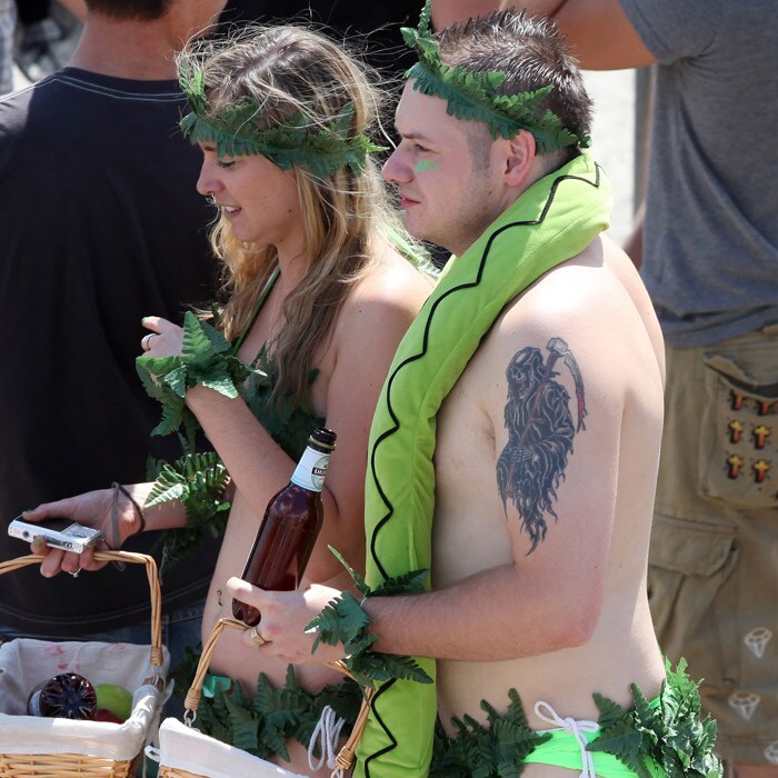 The hugely popular dance festival also sees many come dressed as per different themes. In this picture participants of the Love Parade 2010 have come dressed as Adam and Eve. (AFP Photo).