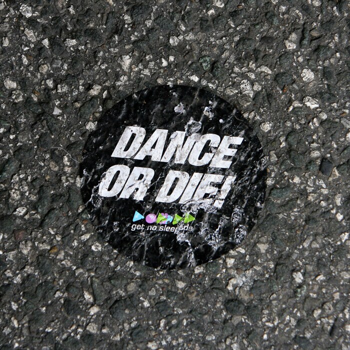 Dance and music are the main attractions of the Love Parade.<br> <br>The picture of a sticker with the words "dance or die" lying crushed on the ground, shows how that fateful day had something else in store for the visitors.  (AFP Photo).