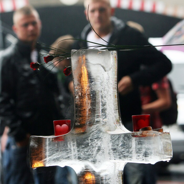 A cross made of ice, candles and flowers drew maximum eyeballs at the make-shift memorial site. (AFP Photo).