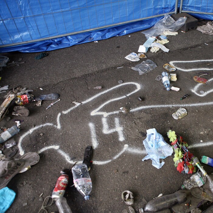 Investigations are on to find out what caused the ruckus.<br><br> One can see the outlines of the bodies that were drawn by the police. (AFP Photo).