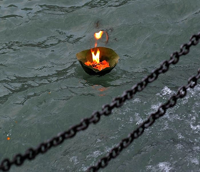 The overwhelming sights and sounds of the Mahakumbh are building up for a three-month spectacle of religious fervor as millions make a bid for salvation. <br/><br/>Here, a prayer lamp floats down the river Ganges as devotees offer their prayers at the religious fair. <br/><br/> The first written evidence of the Kumbh Mela can be found in the accounts of Chinese traveller, Huan Tsang who visited India, during the reign of King Harshavardhana. (AP Photo)