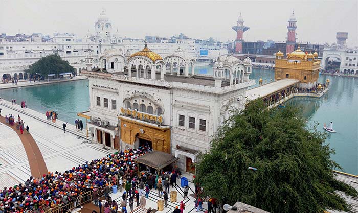 Sikh devotees pay obeisance at the Golden Temple on the occasion of Makar Sankranti in Amritsar. (Press Trust of India)