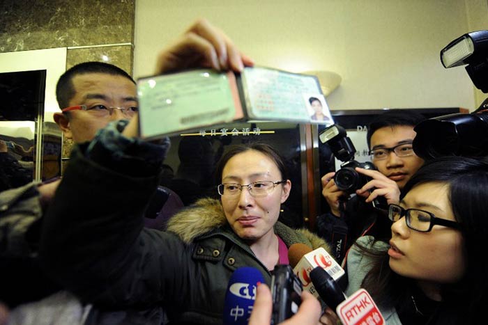 A woman displays the driver's licence of a friend who may be a passenger on board the missing flight.

Malaysia Airlines is yet to confirm whether the aircraft has crashed.