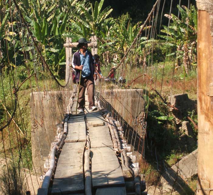 Since the motorable bridges was washed away villagers have constructed a hanging bridge to cross over. (Photo courtesy: Kishalay Bhattacharjee)