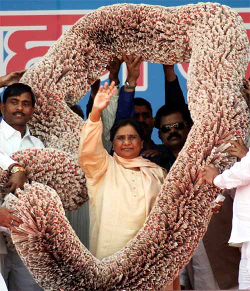 And then, controversy struck. At a party rally this year, Mayawati was presented a garland made of 1,000 rupee notes in front of a gathering of five lakh people, most of who can barely afford one square meal.