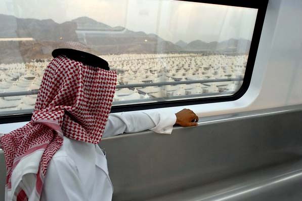 Many of the hillsides surrounding the city ?will soon be marred by new rail lines, roads and tunnels, while others are being carved up to make room for still more towers.?<br><br>Left, a new high-speed commuter train runs from Mecca to Medina. (NYT Photo)