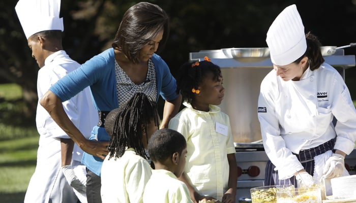 During Wednesday's fair, she delivered a pep talk about eating well, while chefs demonstrated how to make healthy but delicious snacks. The First Lady also told the children it was OK to have treats, as long as they usually ate the right kind of foods to maintain a balanced diet. (AP Photo)