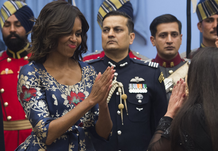 Oh, My Love for Florals: After the airport, the first outing in India for the First Lady was the State Dinner at Rashtrapati Bhavan in the evening. <br><br>Michelle Obama was seen wearing a stark navy blue billowy dress with red and white flowers.