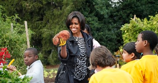 One gigantic sweet potato weighed in at four pounds (1.8 kilograms) on its own, drawing an admiring stare from the the first lady. (AP Photo)