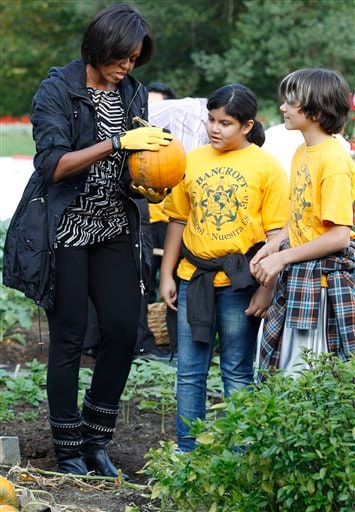 US First Lady Michelle Obama teamed up with local school children and some world class chefs on Wednesday to harvest vegetables from the White House garden that would be donated to various shelters around the capital. (AP Photo)