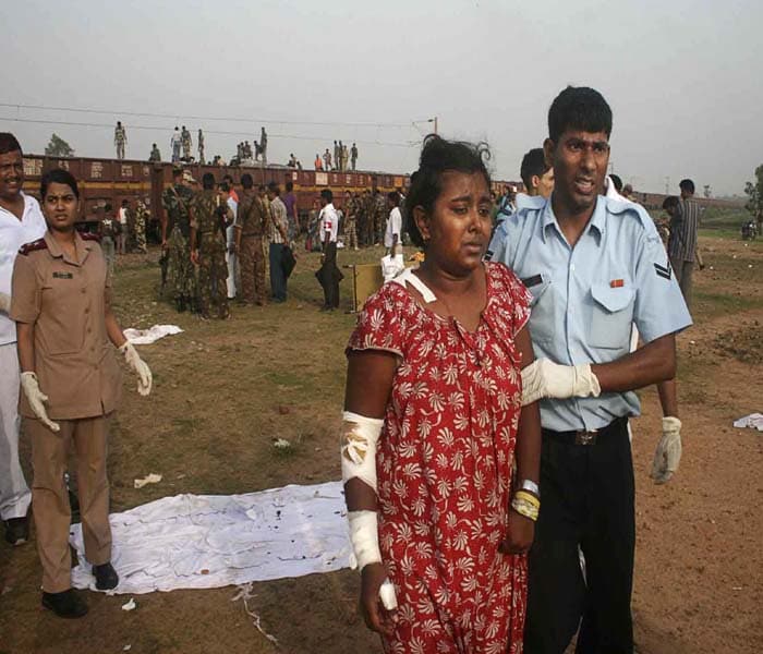 Relief officials used gas cutters to extricate trapped passengers and bodies from the mangled remains of the affected coaches. Passengers belongings lay strewn scattered on the tracks.(AP Image)