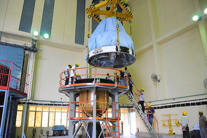 PSLV-C25 fourth stage being hoisted during its integration with the third stage.<br><br>Photo Credit: ISRO