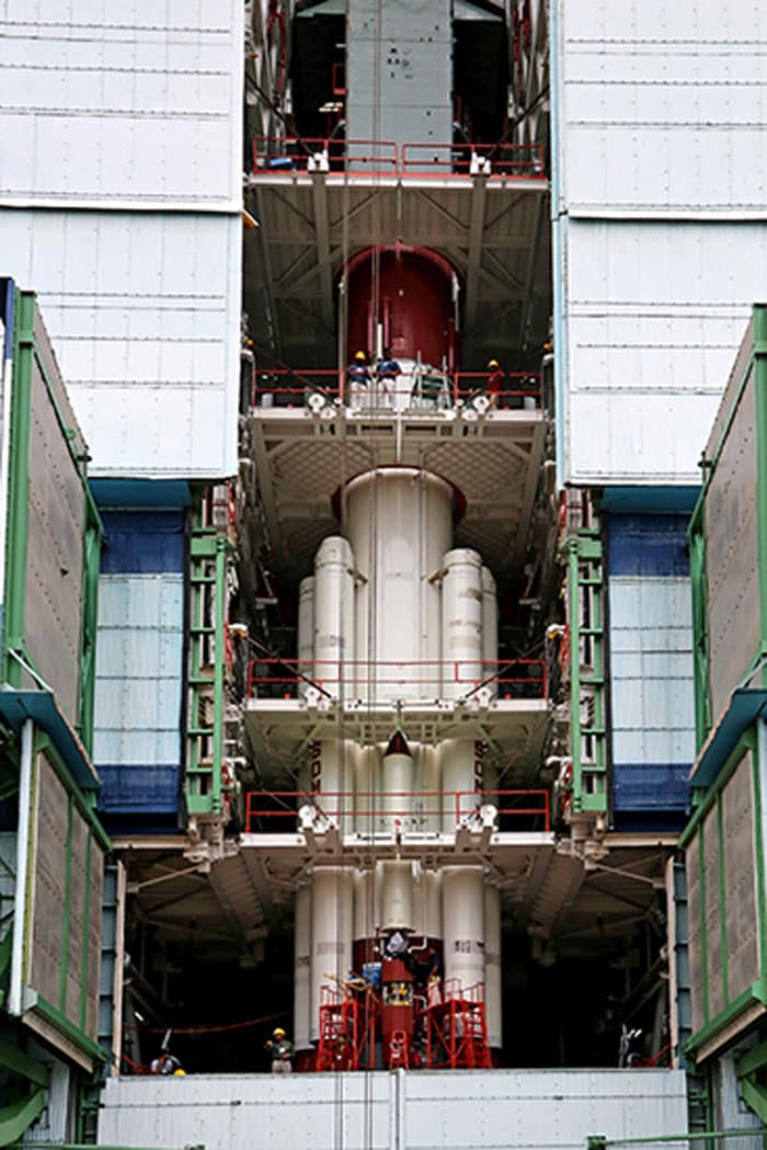 PSLV-C25 first stage being surrounded by strap-ons in the Mobile Service Tower.<br><br>Photo Credit: ISRO