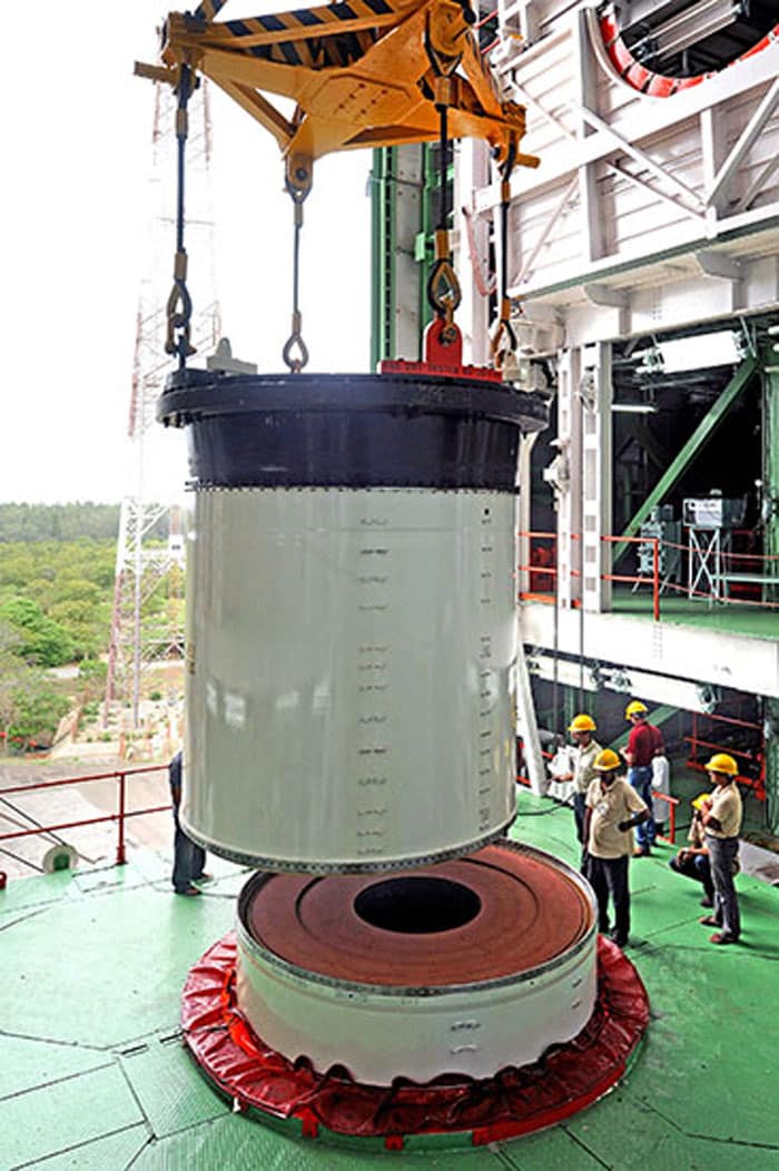 Joining of two segments of PSLV-C25 First Stage in progress in the Mobile Service Tower.<br><br>Photo Credit: ISRO