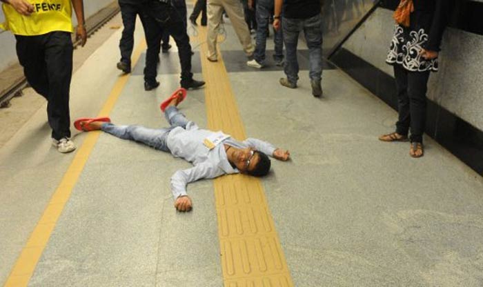 Volunteers pretended to be wounded on a train platform during the mock drill. (AFP image)