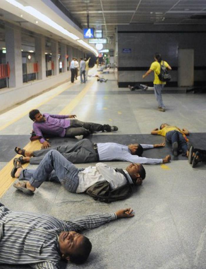 Volunteers pretended to be wounded on a train platform during the mock drill. (AFP image)