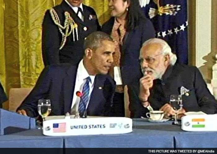 PM Narendra Modi confers with President Brack Obama at NSS dinner.